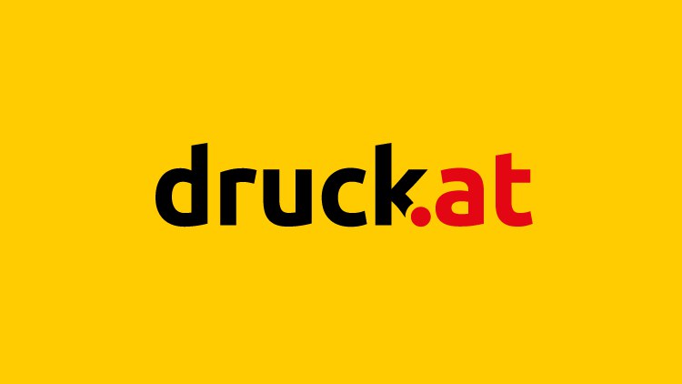 Logo von druck.at: schwarzer Schriftzug „druck“ und roter Schriftzug „.at“ auf gelbem Grund